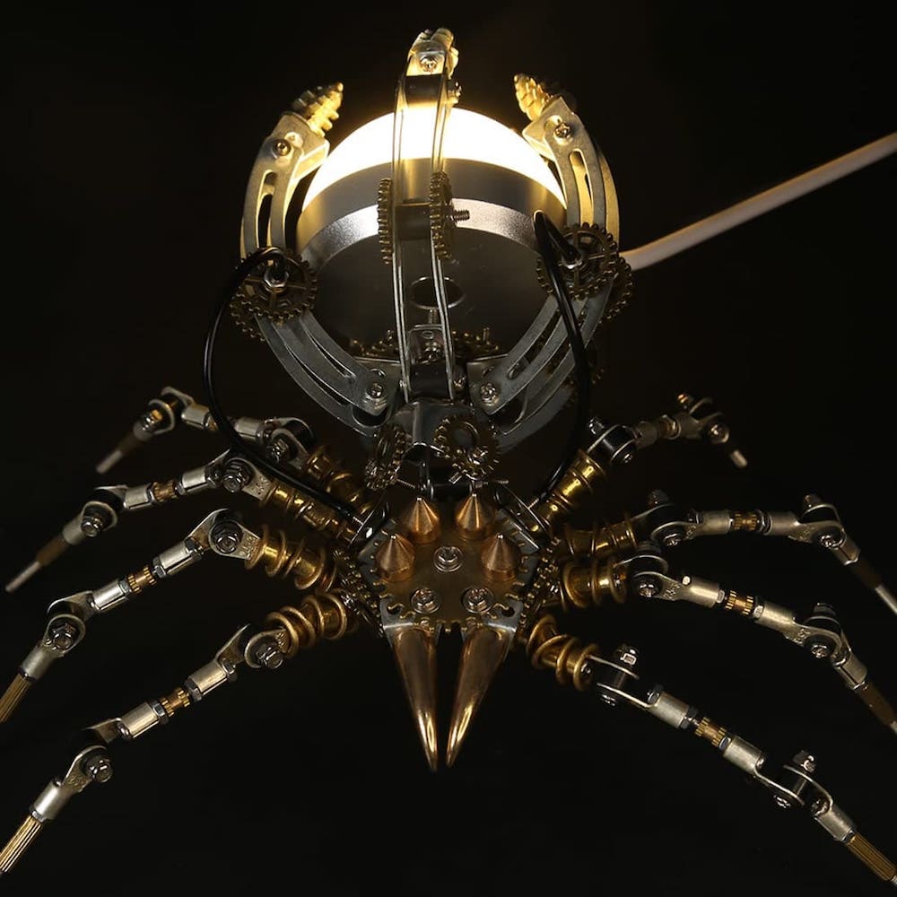 3D-modell av et edderkopppuslespill i metall